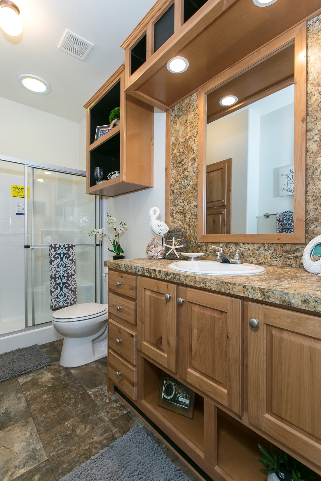 The ING382F REDWOOD II   (FULL) GW Primary Bathroom. This Manufactured Mobile Home features 2 bedrooms and 2 baths.