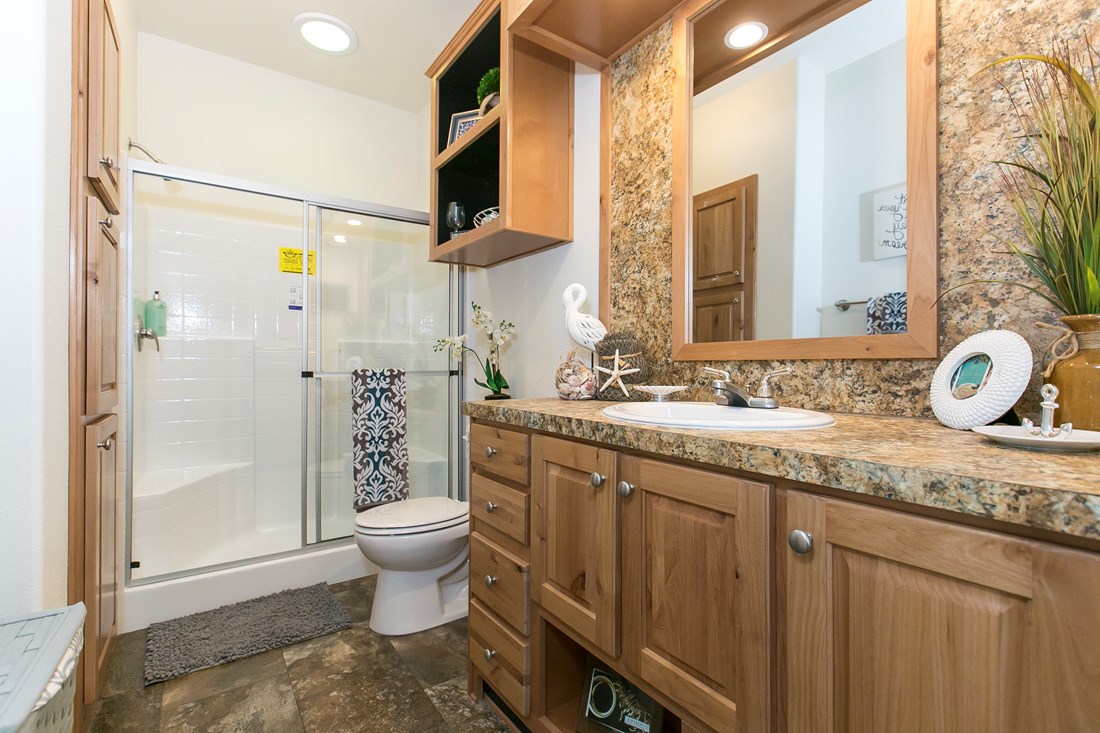 The ING382F REDWOOD II   (FULL) GW Master Bathroom. This Manufactured Mobile Home features 2 bedrooms and 2 baths.