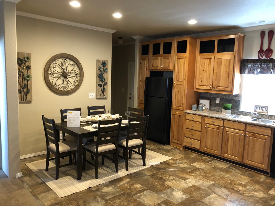 The THE FRASER Kitchen. This Manufactured Mobile Home features 3 bedrooms and 2 baths.