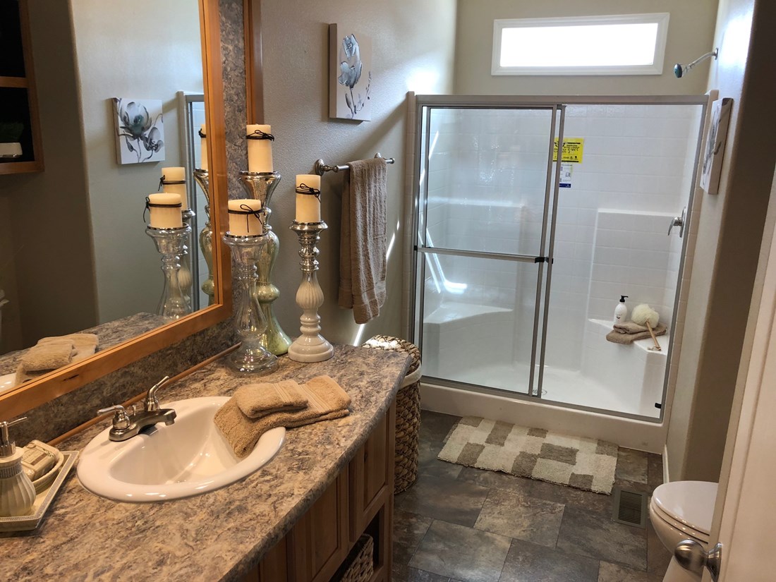 The THE FRASER Master Bathroom. This Manufactured Mobile Home features 3 bedrooms and 2 baths.
