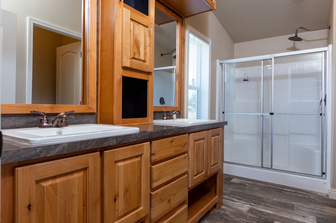 The ING564F SHASTA       (FULL) GW Master Bathroom. This Manufactured Mobile Home features 3 bedrooms and 2 baths.