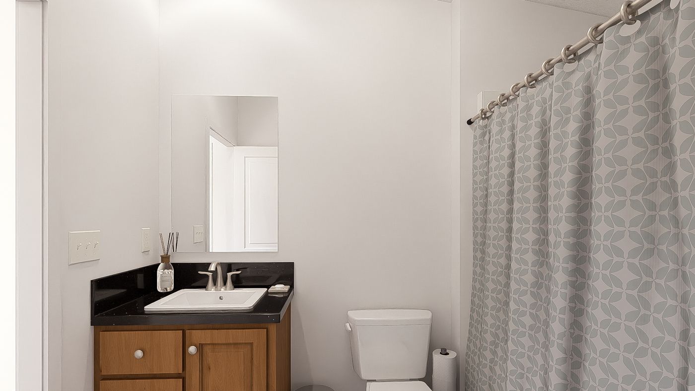 The DRM601M 60' DREAM Guest Bathroom. This Manufactured Mobile Home features 1 bedroom and 2 baths.
