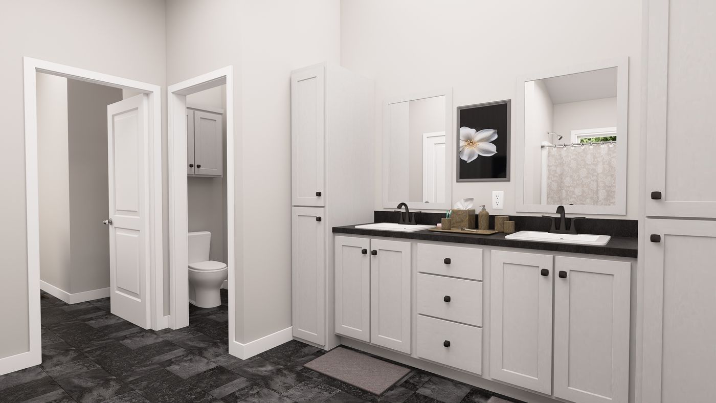 The ING602K GENERAL SHERMAN GW Primary Bathroom. This Manufactured Mobile Home features 3 bedrooms and 2 baths.